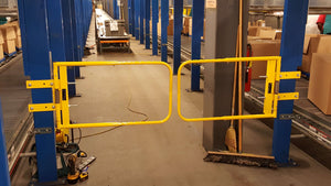Industrial Safety Swing Gates next to conveyor saloon door style